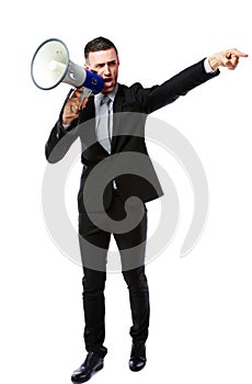 Businessman yelling through megaphone
