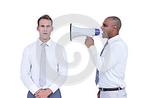 Businessman yelling with a megaphone at his colleague