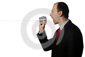 Businessman yelling through an oldschool can phone