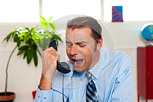 Businessman yelling during the phone call