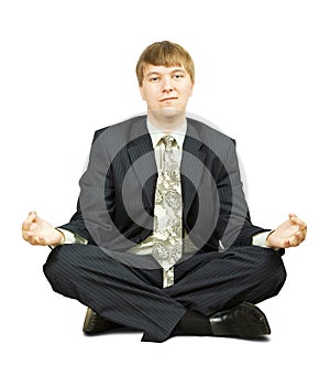 Businessman in yoga lotus pose