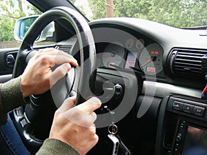 Businessman, young man driving car. Business concept. Steering wheel repair