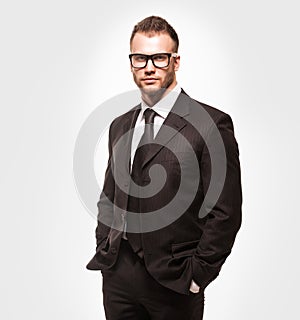 Businessmanman in black suit and glasses