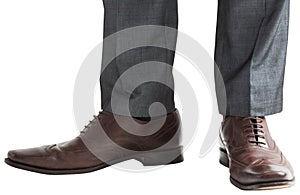 Businessmans feet in brown brogues photo