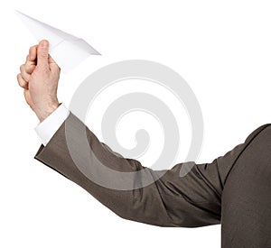 Businessmans hand holding paper plane