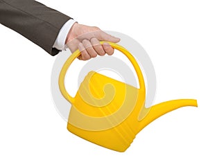 Businessmans hand with watering-can