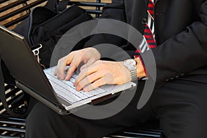 Businessmans hands on laptop