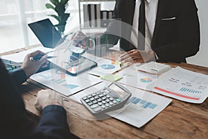 Businessmen are attending a meeting about finances, Discussing tax payments in the conference room, Meeting to plan marketing to