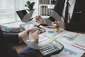 Businessmen are attending a meeting about finances, Discussing tax payments in the conference room, Meeting to plan marketing to