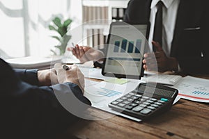 Businessmen are attending a meeting about finances, Discussing tax payments in the conference room, Meeting to plan marketing to