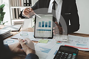 Businessmen are attending a meeting about finances, Discussing tax payments in the conference room, Meeting to plan marketing to