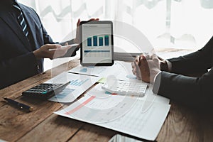 Businessmen are attending a meeting about finances, Discussing tax payments in the conference room, Meeting to plan marketing to