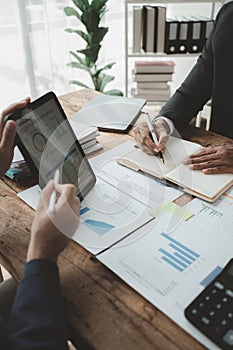 Businessmen are attending a meeting about finances, Discussing tax payments in the conference room, Meeting to plan marketing to