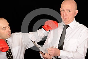 Businessmen with boxing gloves