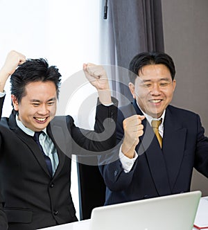 Businessmen celebrate