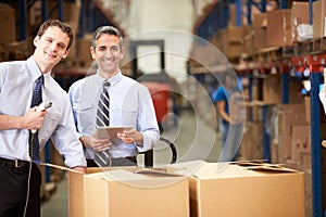 Businessmen Checking Boxes With Digital Tablet And Scanner