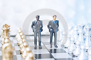 Businessmen on chessboard