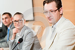 Businessmen communicate at the conference