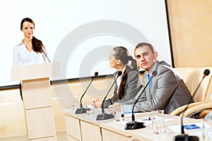 Businessmen communicate at the conference