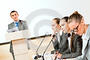 Businessmen communicate at the conference