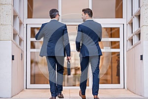 Businessmen communicating at meeting. Two businessmen discussing outdoor during business meeting. Businessmen talking