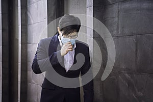 Businessmen, company employees wear protective masks to prevent PM 2.5 dust and virus COVID-19. Businessman air excessively smelli photo