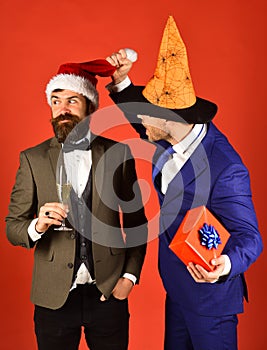 Businessmen with curious faces pose on holiday party