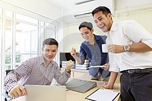 Businessmen are delighted with increased sales. Businessman smiling in office. Excited businessman celebrating.