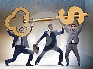 Businessmen with dollar key unlocking door