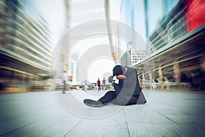 Businessmen failing and serious sit with black bag