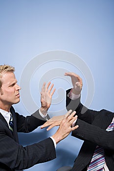 Businessmen fighting