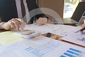 Businessmen, financial accountants, business planners, business planning ideas using computers, laptops, smat phones, and work