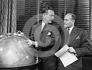 Businessmen with globe