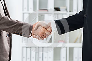 Businessmen handshake closeup