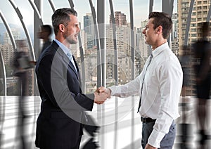 businessmen handshake in the corridor of the office