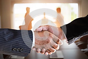 Businessmen handshaking in a meeting room.acquisition concept.