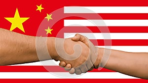 Businessmen handshaking on Usa or American and China flags merged relationship concept