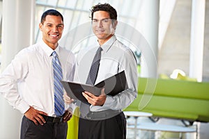 Businessmen Having Informal Meeting In Modern Office