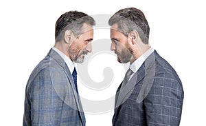 businessmen having rivalry in studio. rivalry of mature businessmen in suit. photo of businessmen