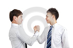 Businessmen holding hand for cooperation