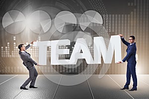 The businessmen holding word team in teamwork concept