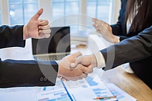 Businessmen and investors join hands symbolize friendship and cooperation in business success. concepts of group of businessmen