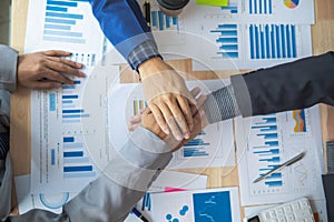 Businessmen and investors shake hands after attending meeting with advisory team after receiving advice from advisory team about