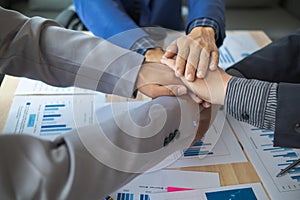 Businessmen and investors shake hands after attending meeting with advisory team after receiving advice from advisory team about