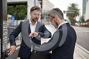 businessmen late have time deadline at street light, selective focus. businessmen late