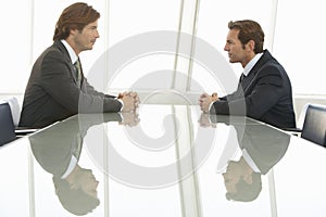 Businessmen Looking At Each Other In Conference Room