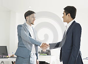 Businessmen making handshake agreement.