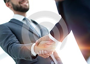 Businessmen making handshake - business etiquette, congratulatio