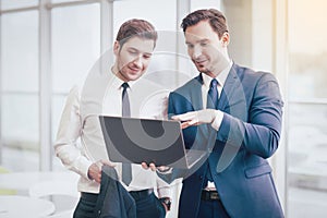 Businessmen making project with a laptop