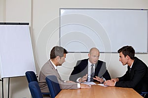 Businessmen in meeting at board room